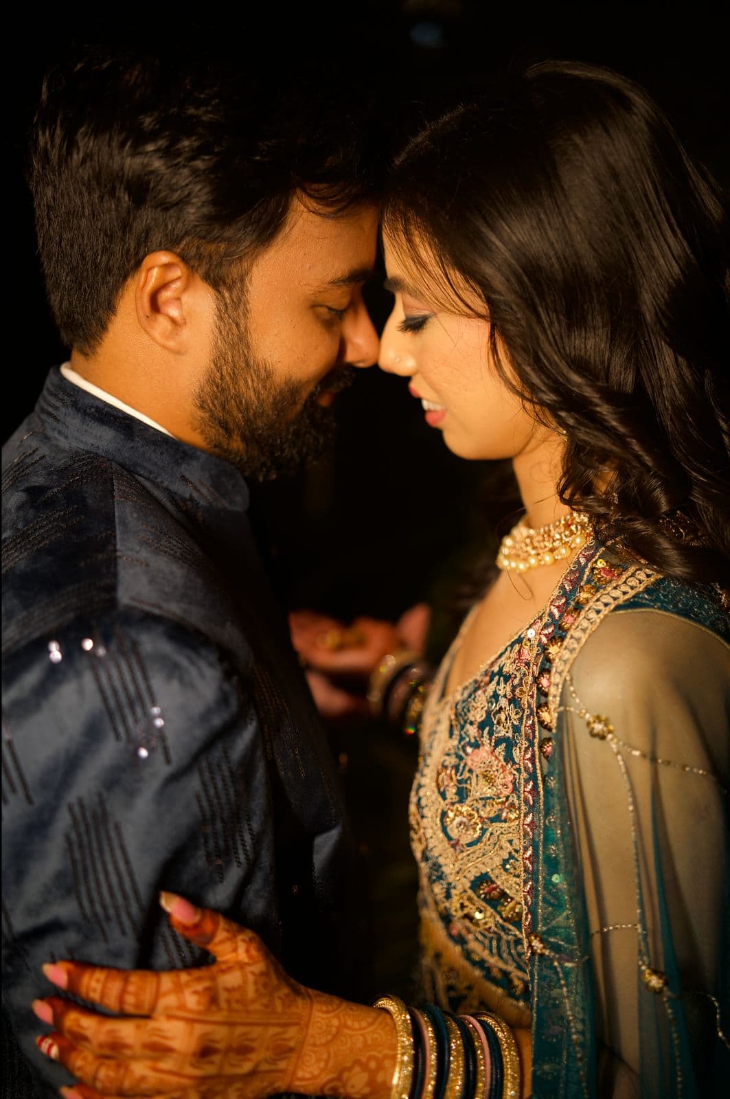 Intimate couple portrait — foreheads touching