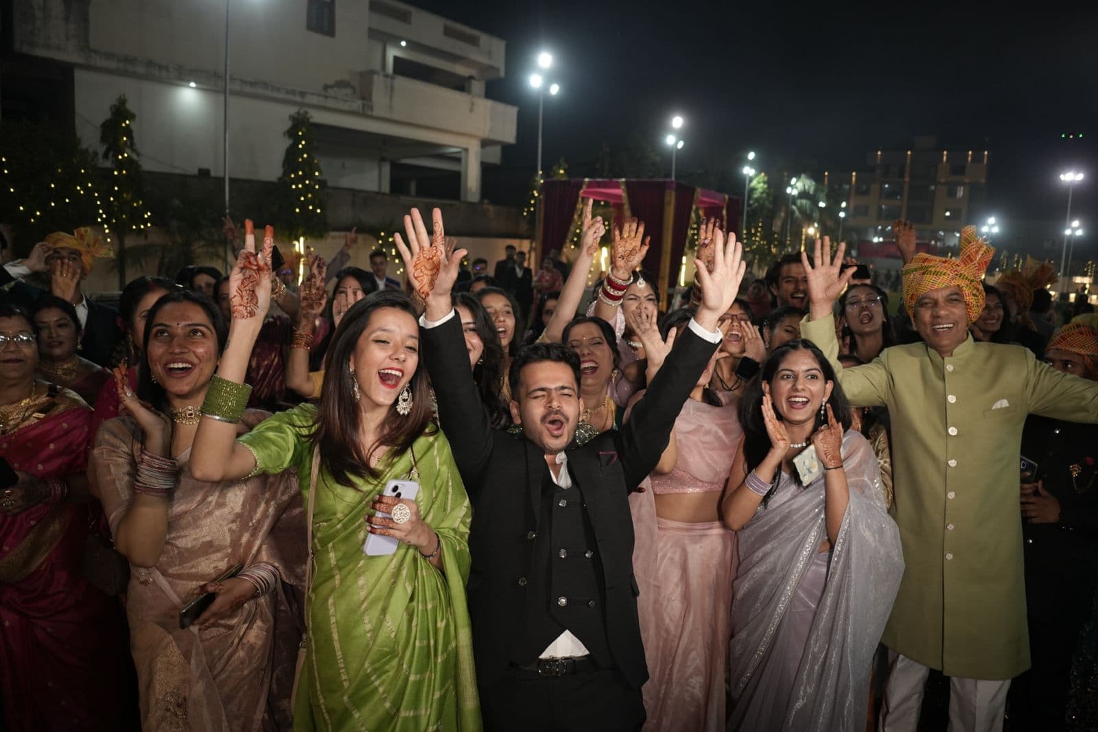 Indian wedding night celebration with guests cheering